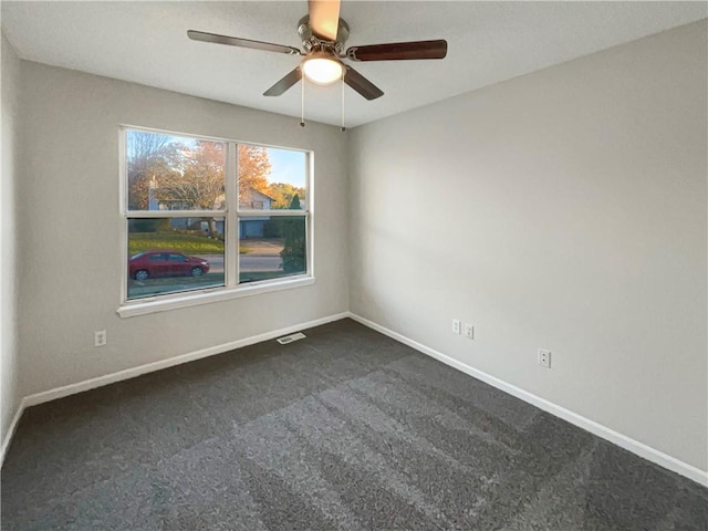 carpeted empty room with ceiling fan