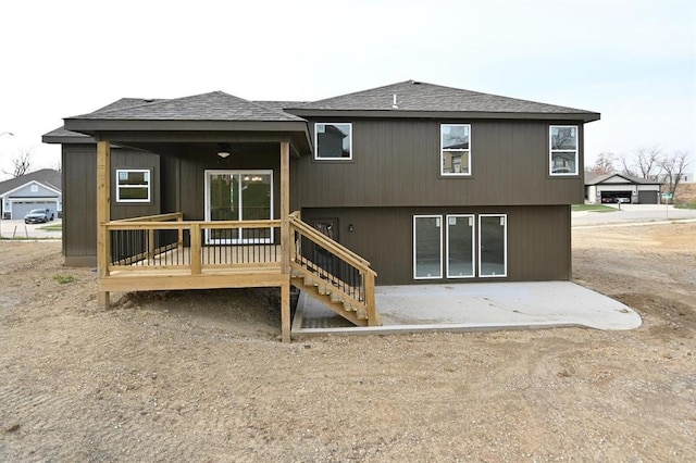 back of property with a patio and a deck