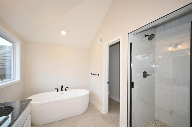 bathroom with lofted ceiling, shower with separate bathtub, and vanity