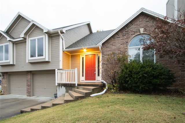 view of front of home featuring a garage and a front lawn