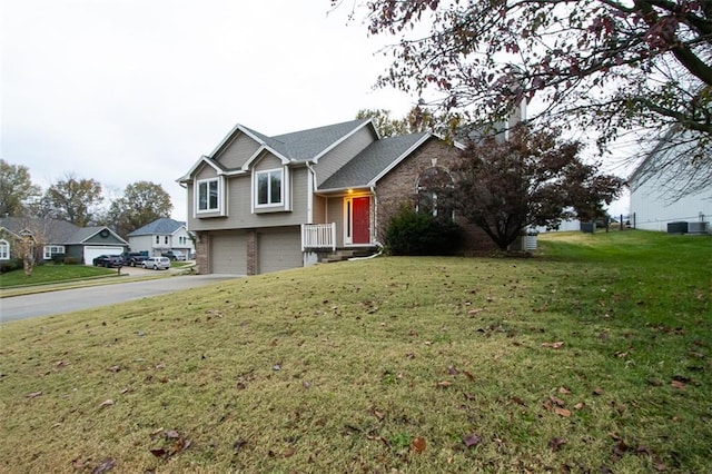 view of front facade with a garage and a front lawn