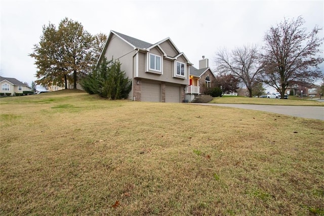 view of property exterior with a garage and a lawn