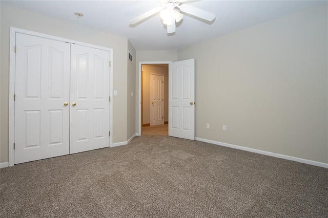 unfurnished bedroom with carpet flooring, ceiling fan, and a closet