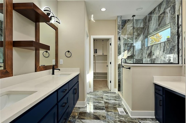 bathroom featuring vanity and a shower with shower door