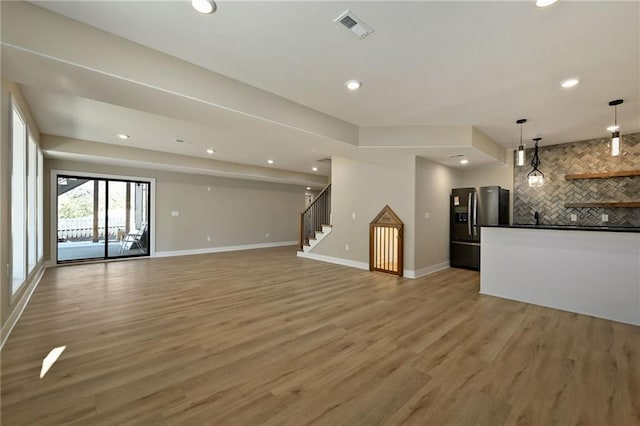 unfurnished living room with hardwood / wood-style flooring