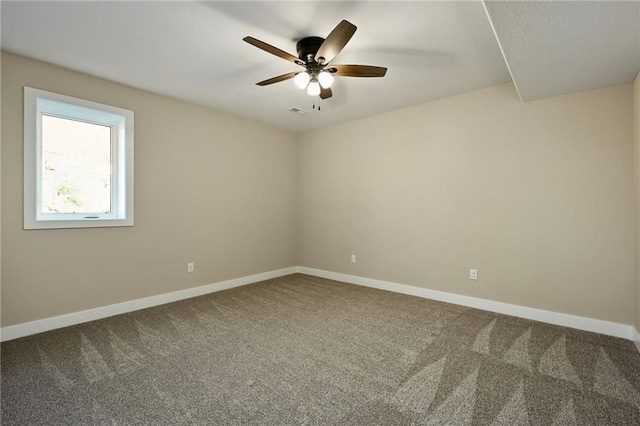 carpeted empty room featuring ceiling fan