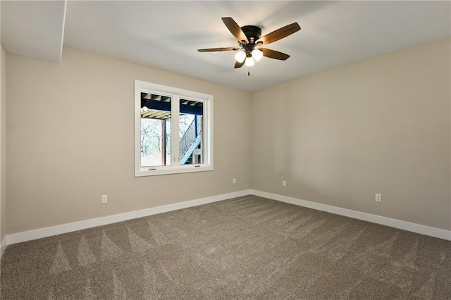 spare room with carpet and ceiling fan