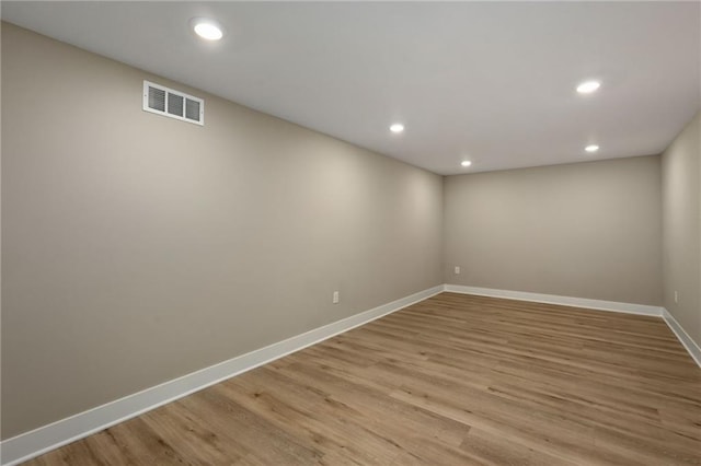 unfurnished room with light hardwood / wood-style flooring