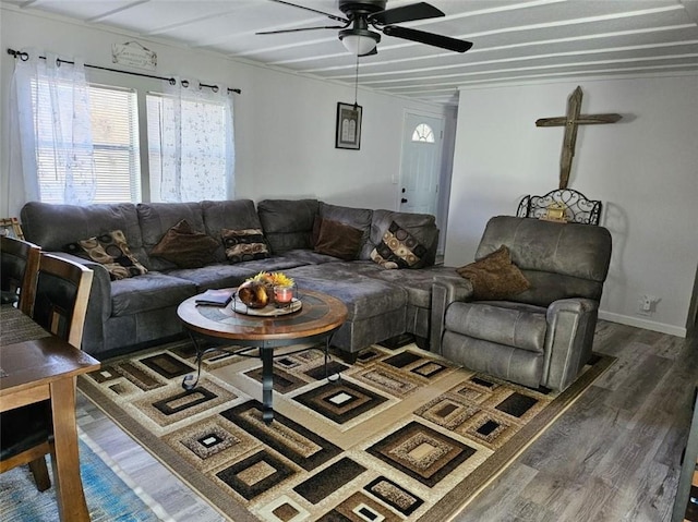 living room featuring dark hardwood / wood-style floors and ceiling fan