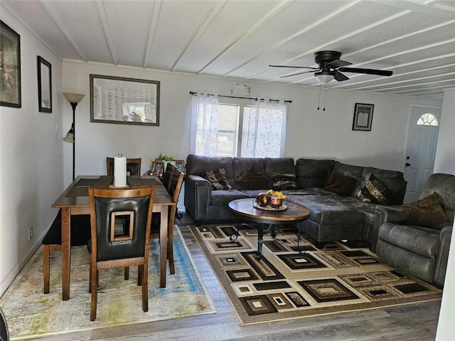 living room with dark hardwood / wood-style floors and ceiling fan