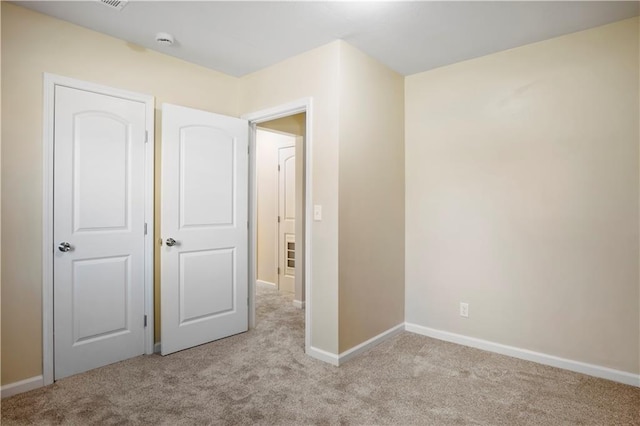 unfurnished bedroom with light carpet