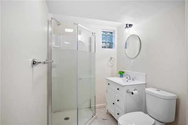 bathroom featuring a textured ceiling, vanity, an enclosed shower, and toilet