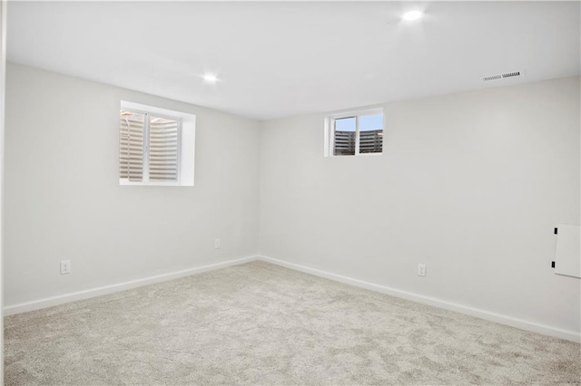 basement with light colored carpet