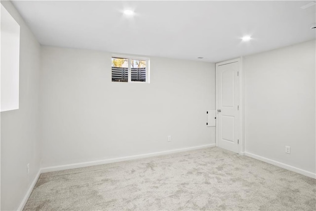 basement featuring light carpet