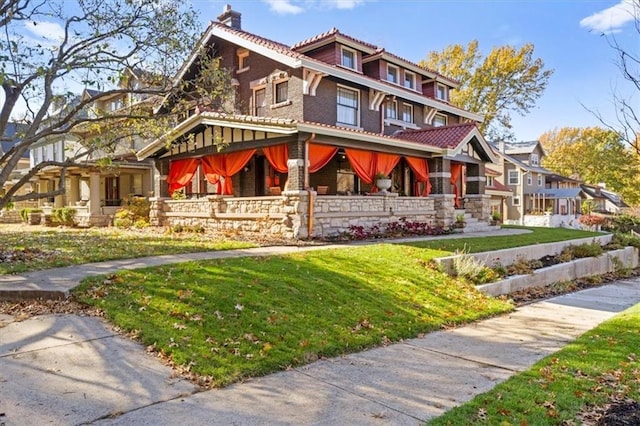 exterior space with a front yard and a porch