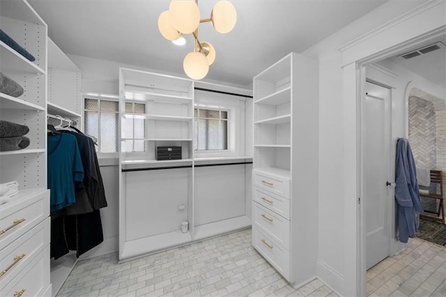 walk in closet featuring visible vents