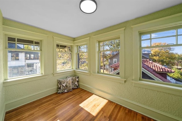 unfurnished sunroom with plenty of natural light