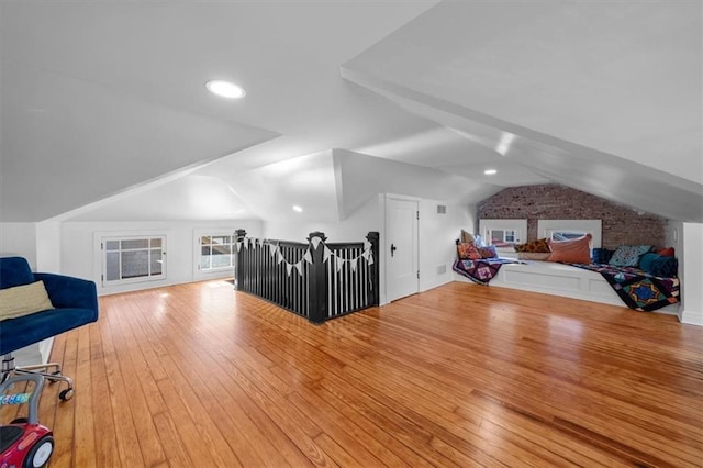 bonus room featuring lofted ceiling and wood finished floors