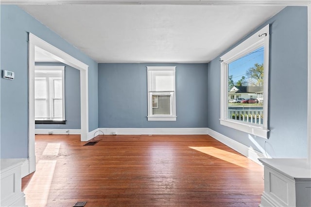 spare room featuring hardwood / wood-style flooring