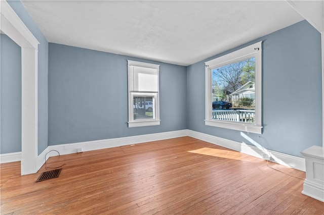 spare room featuring light hardwood / wood-style floors