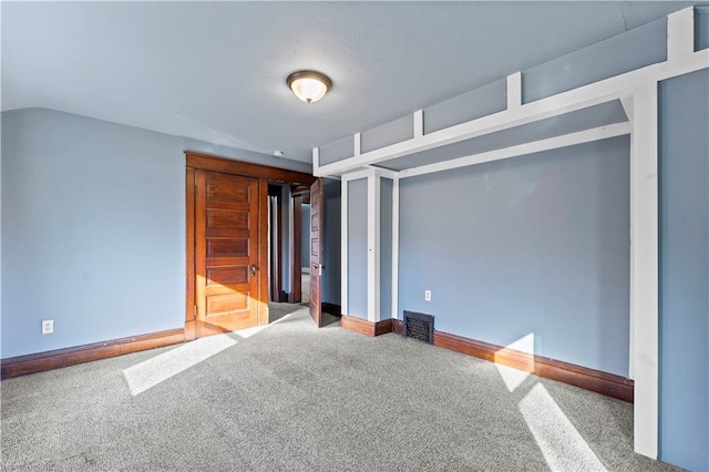 unfurnished bedroom with carpet floors