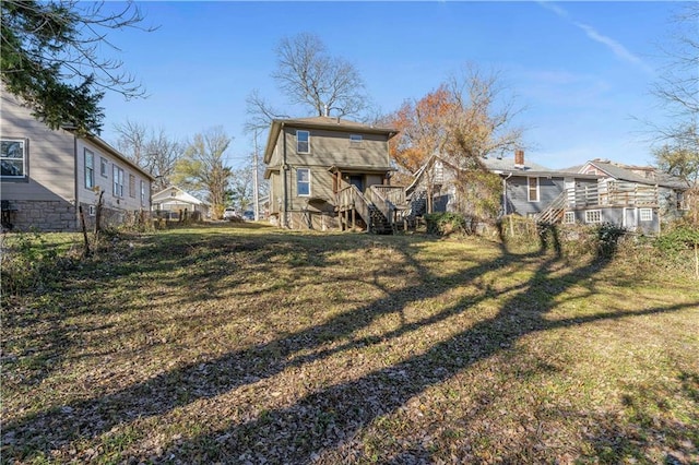 back of house with a yard