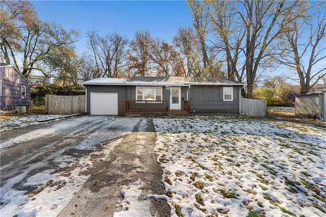 single story home featuring a garage