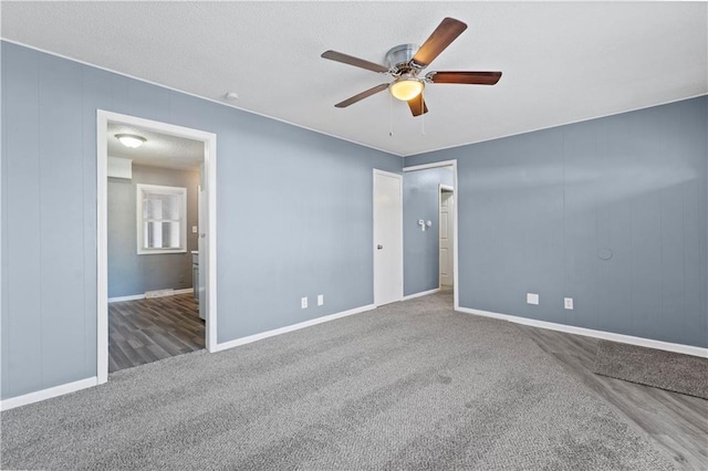 unfurnished bedroom with ceiling fan and hardwood / wood-style floors