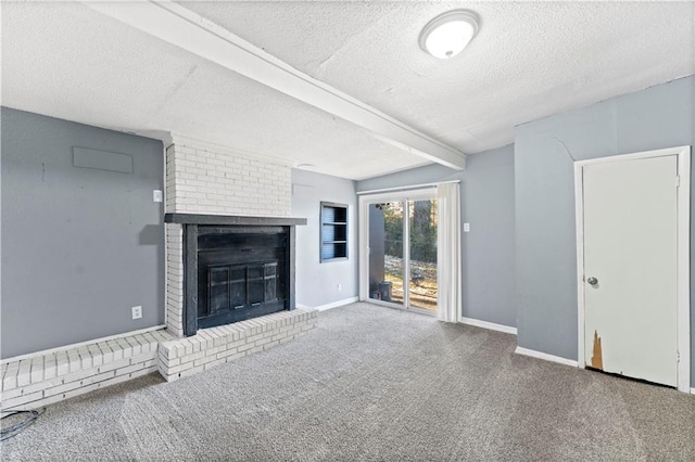 unfurnished living room featuring carpet flooring, beam ceiling, a fireplace, and a textured ceiling