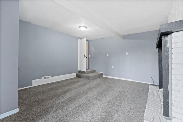 unfurnished living room with beam ceiling and dark carpet