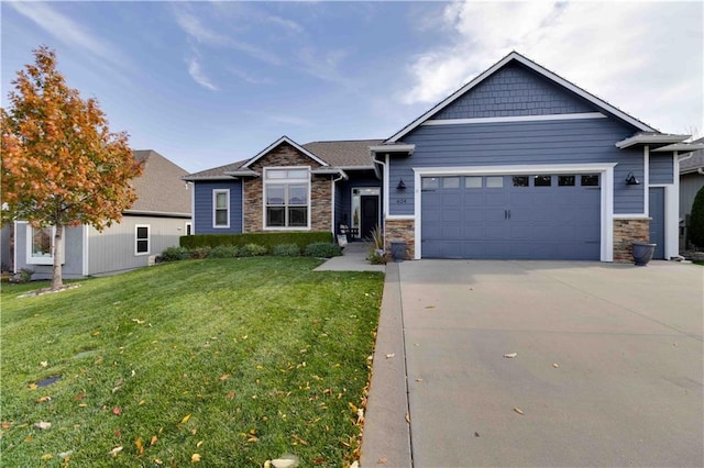 view of front of property featuring a garage and a front lawn