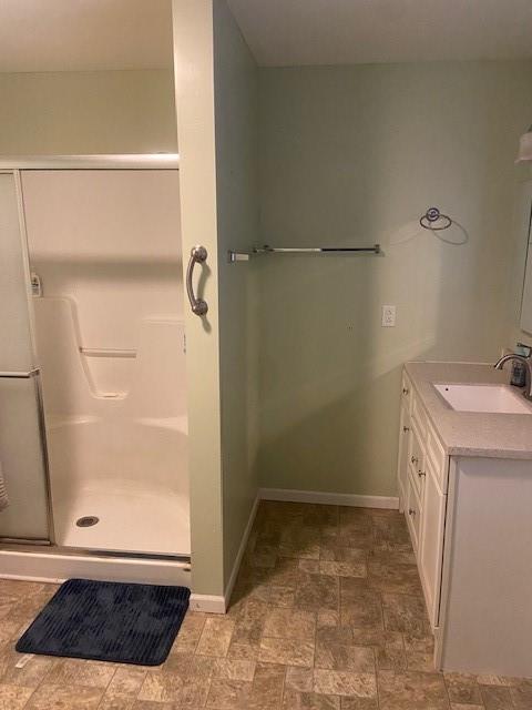 bathroom with vanity and an enclosed shower