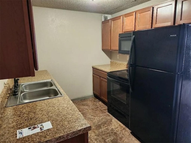 kitchen with sink, carpet, black appliances, and a textured ceiling