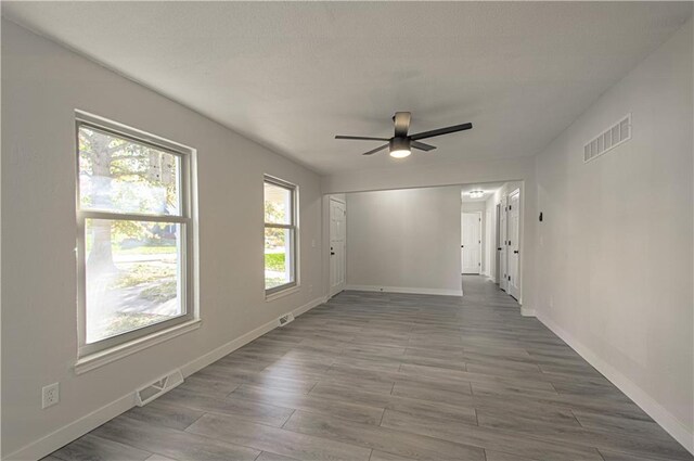 328 Virginia Rd, Excelsior Springs, MO 64024 - spare room with ceiling fan, healthy amount of natural light, and baseboards