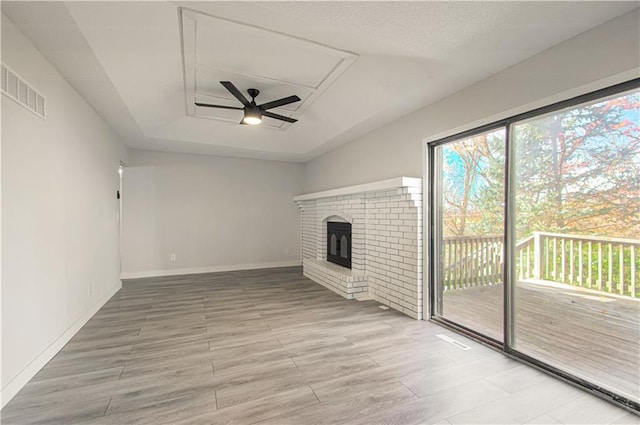 unfurnished living room with hardwood / wood-style flooring and ceiling fan