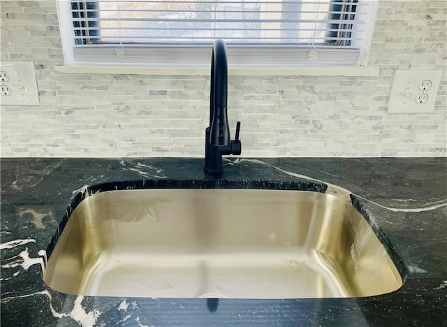 details featuring backsplash and sink