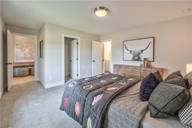 bedroom featuring light carpet and baseboards