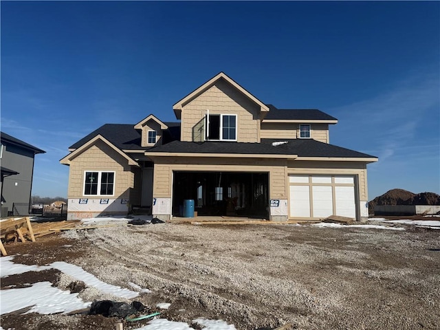 view of front of property featuring an attached garage and driveway