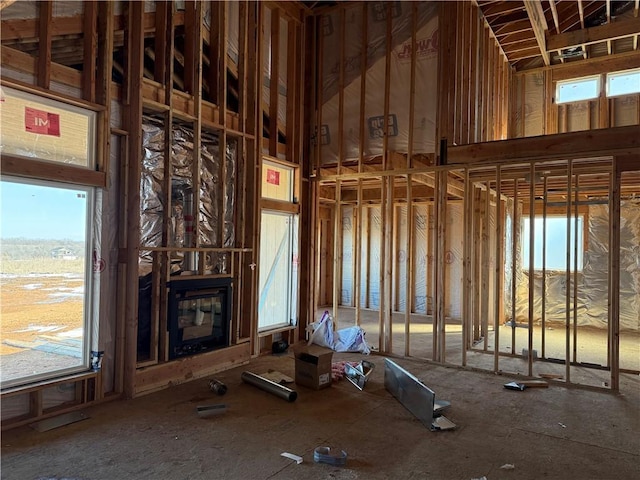 misc room featuring a large fireplace and plenty of natural light