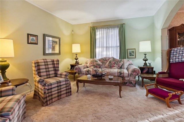 carpeted living room featuring ornamental molding