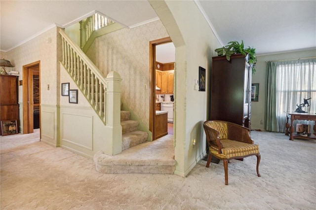 stairs with carpet flooring and ornamental molding