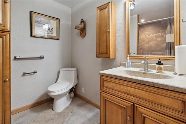 bathroom with a shower with shower curtain, vanity, toilet, and tile patterned floors