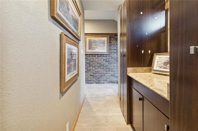 hallway with brick wall