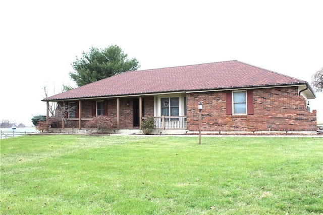 view of front of property with a porch and a front yard