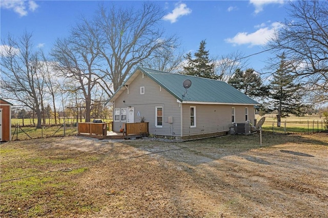 back of property with a wooden deck