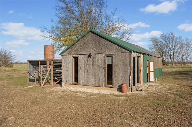 view of outbuilding with a yard