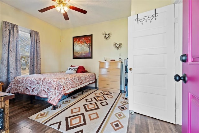 bedroom with hardwood / wood-style floors and ceiling fan