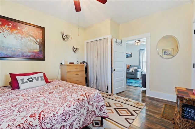 bedroom with crown molding, ceiling fan, and dark wood-type flooring