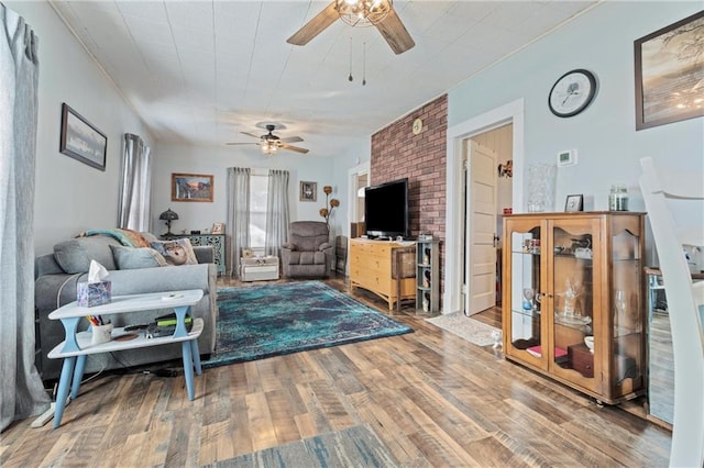 living room featuring ceiling fan and wood-type flooring