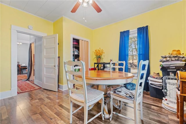 dining room featuring ceiling fan and hardwood / wood-style floors